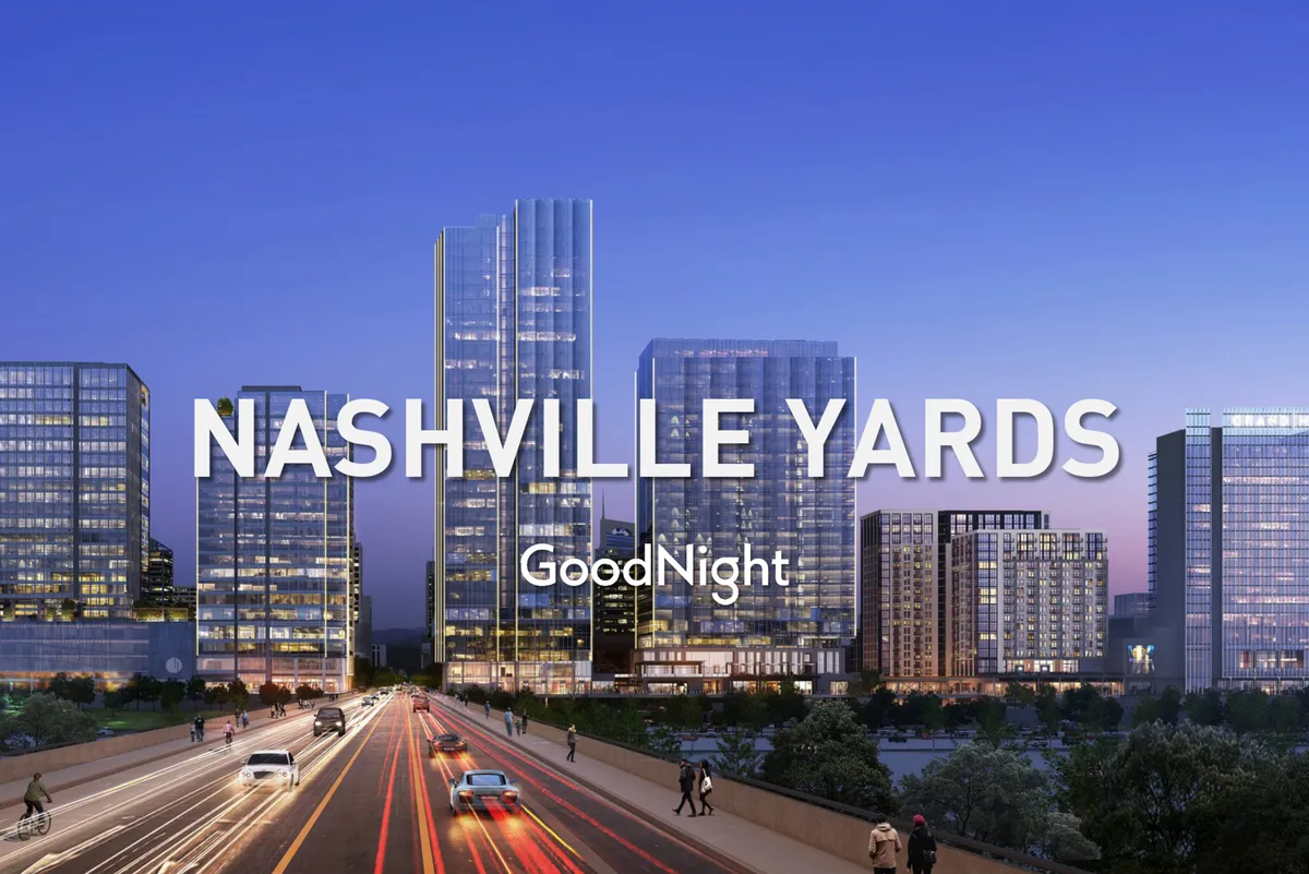 A bustling city exterior with tall glass buildings, colorful sunset lighting, and people enjoying the energetic downtown atmosphere. The scene captures pedestrians, traffic, and vibrant nightlife, giving a sense of Nashville’s urban excitement and diversity.